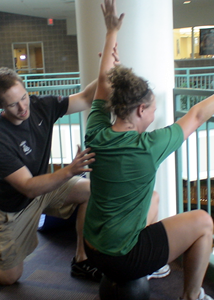 Fitness expert, Dave Reddy, spotting a step back (Shannon Hayes, R.D.)