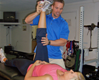 Dave Reddy, performing a hamstring stretch